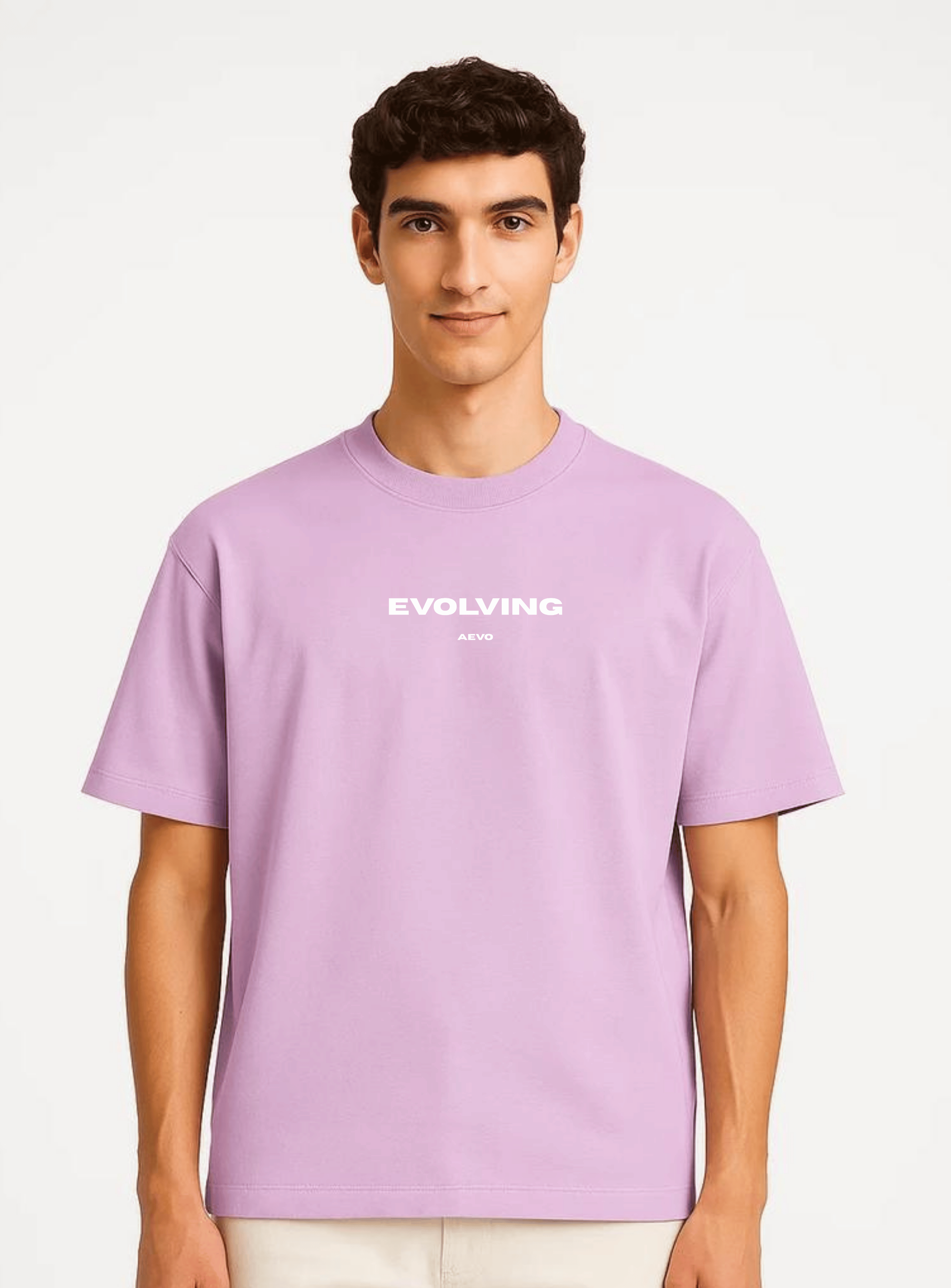 Person wearing a light purple t-shirt with 'Evolving' text on a white background